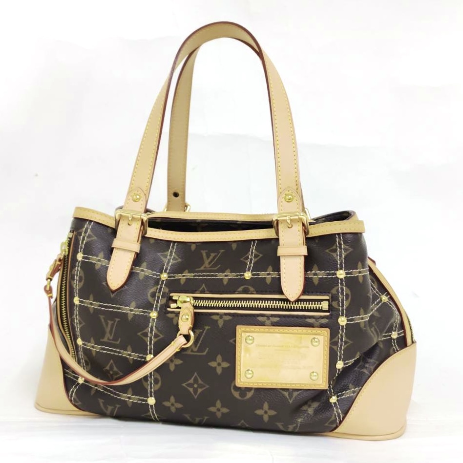 LV モノグラム リベット M40140